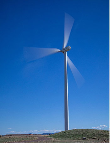 Wind turbine spinning on hill