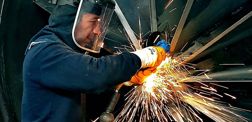 Man welding a turbine.