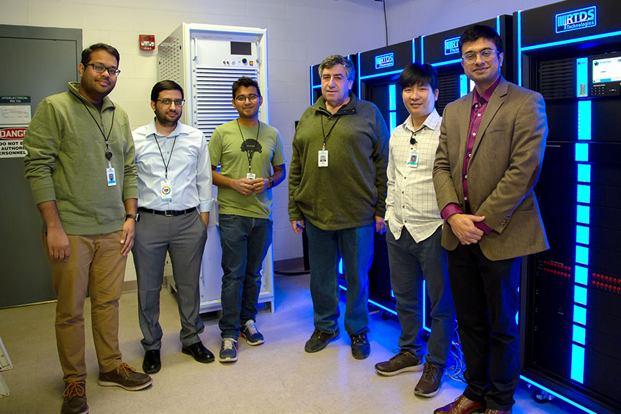 Team in front of the Digital Real Time Simulators.