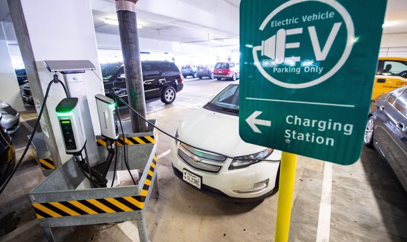 Electric vehicle parked at a charging station