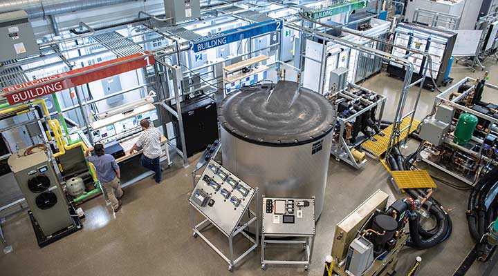 Photo of two researchers working in the Optimization and Control Laboratory in the ESIF