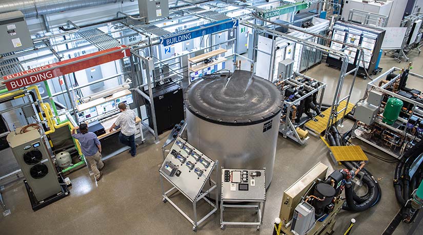 Photo of two researchers working in the Optimization and Control Laboratory in the ESIF, which has been designed with state-of-the-art commercial buildings research infrastructure.