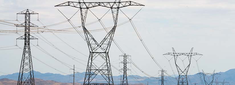 Transmission lines near a mountain range.