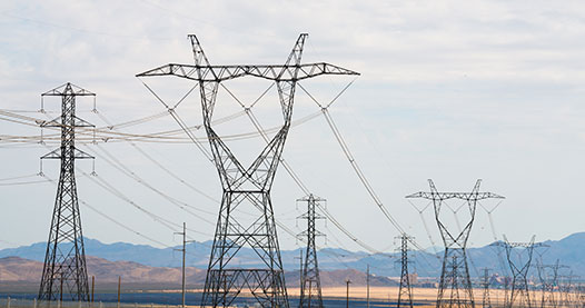 Transmission lines near a mountain range.