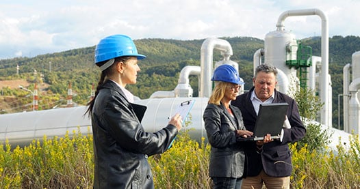 Engineers outside a geothermal power plant.