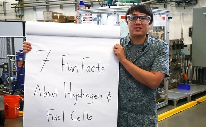 An employees hold a sign that says 