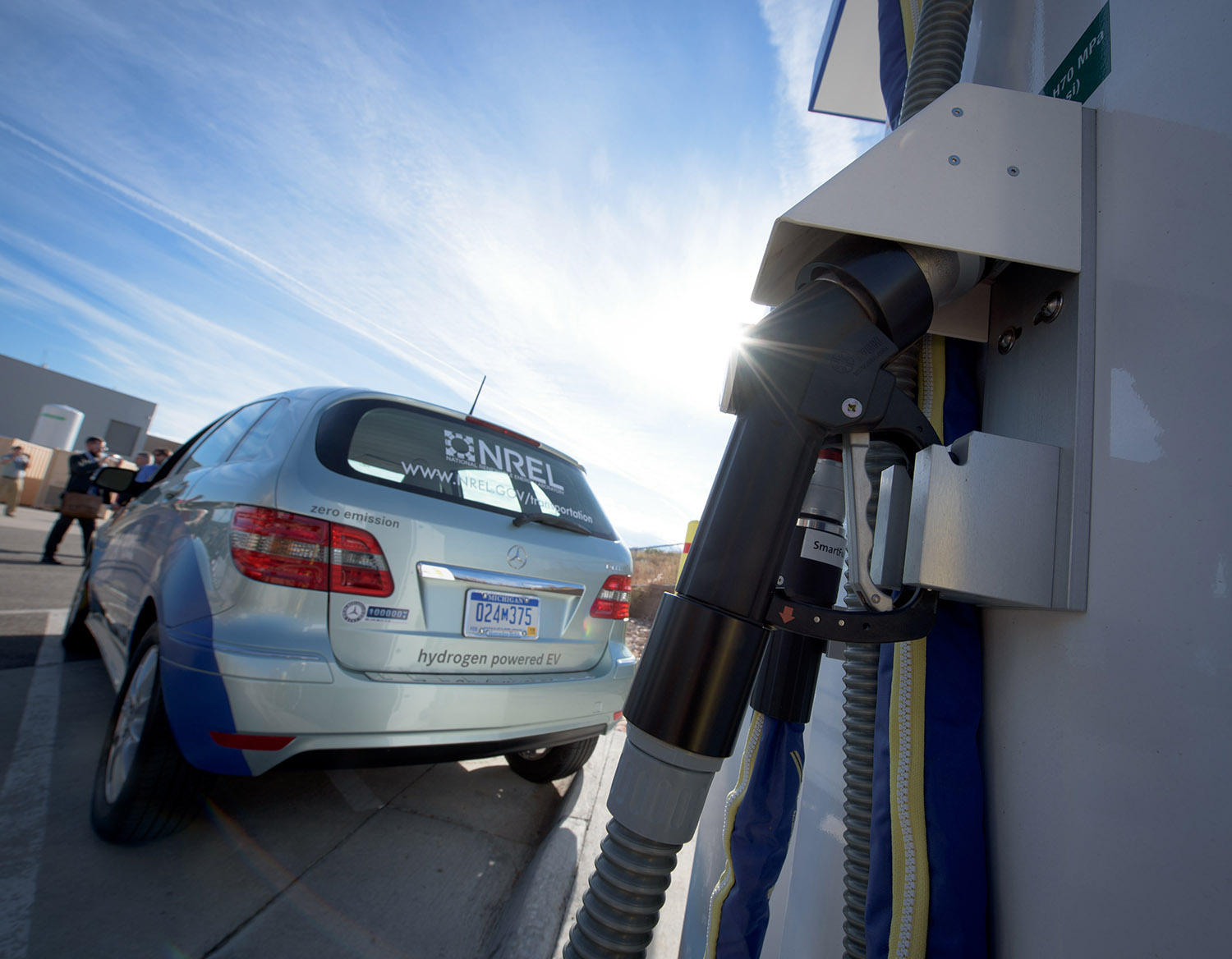 A hydrogen-powered vehicle parked at a fueling station