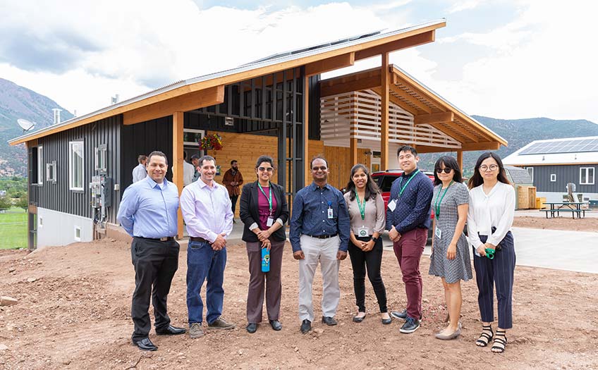 20191210-holycross-nrel-team Development team in front of home.