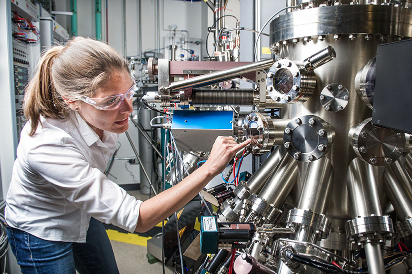A researcher works with scientific equipment in a lab