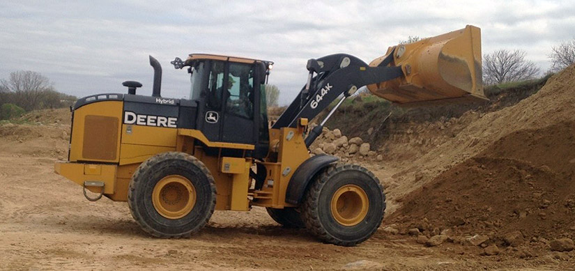 Photo of a construction vehicle moving dirt