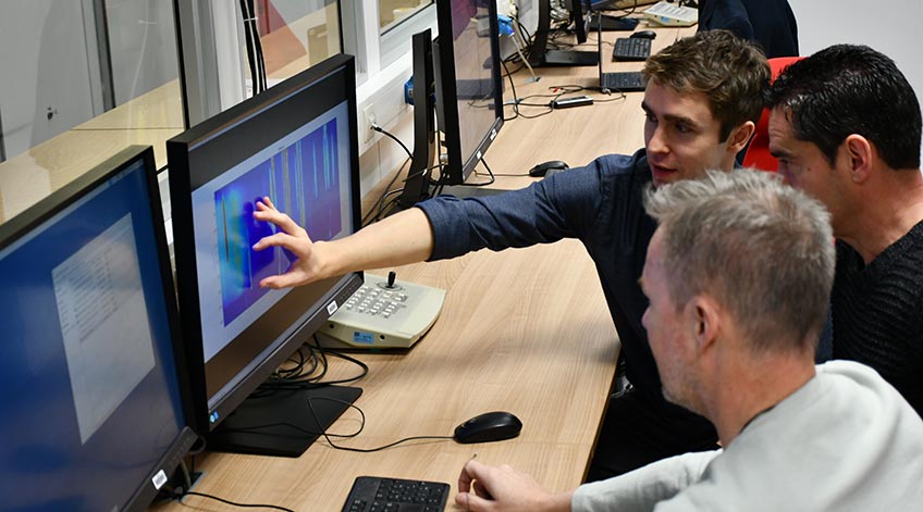 Researcher reviews images from high-speed synchrotron X-ray diffraction experiments.