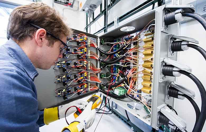 Brian Johnson working on a digital controller