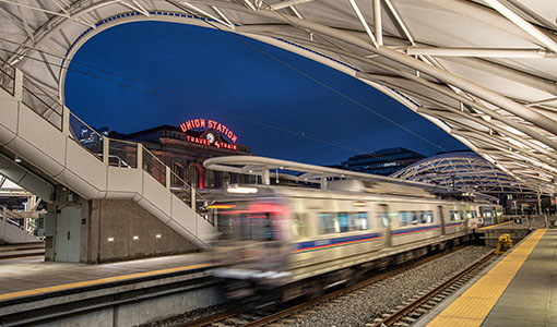 A train moving through a train platform at Denver’s Union Station.