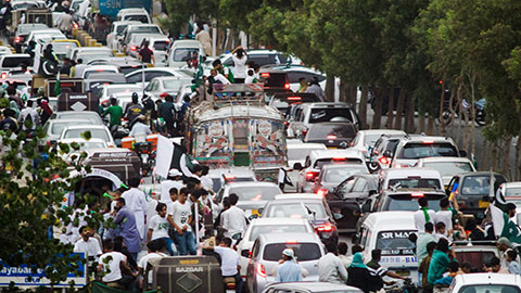 Busy highway full of cars.