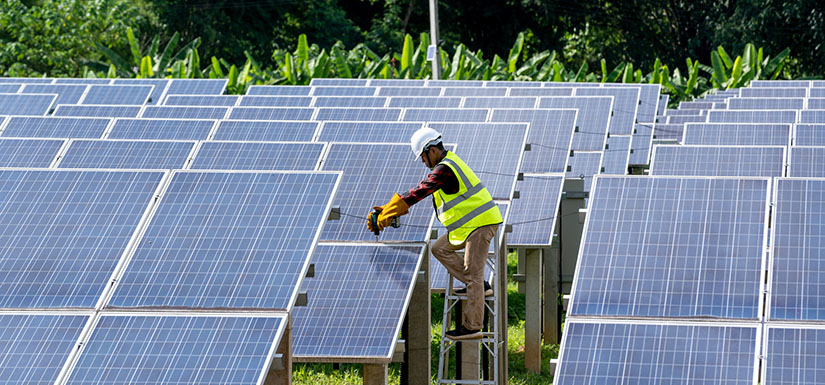 Person installing solar array outside