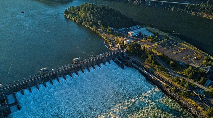 Aerial photo of water flowing through a hydropower plant.