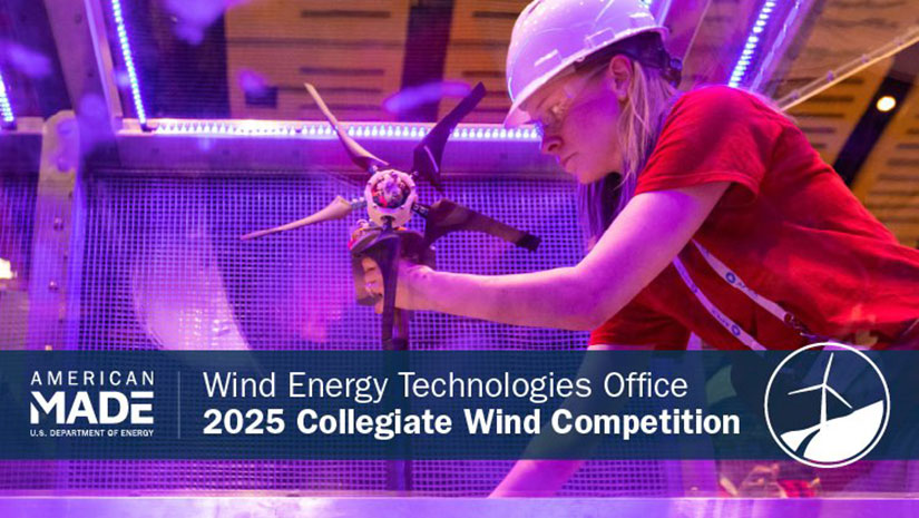 A woman in a hard hat adjusts a model wind turbine inside a wind testing tunnel.