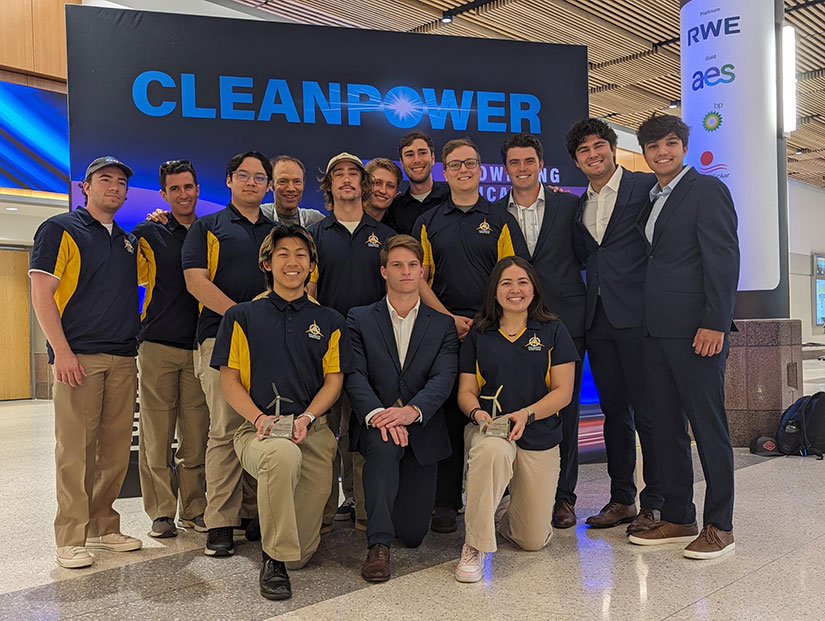 California State University Maritime Academy Collegiate Wind Competition team celebrating with its first-place trophy