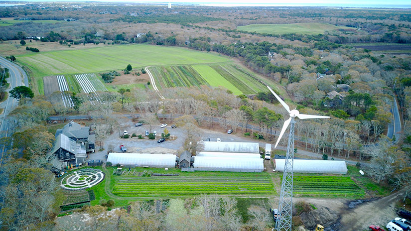 20240723-newsletter-farmers Aerial view of a small wind turbine next to a farm