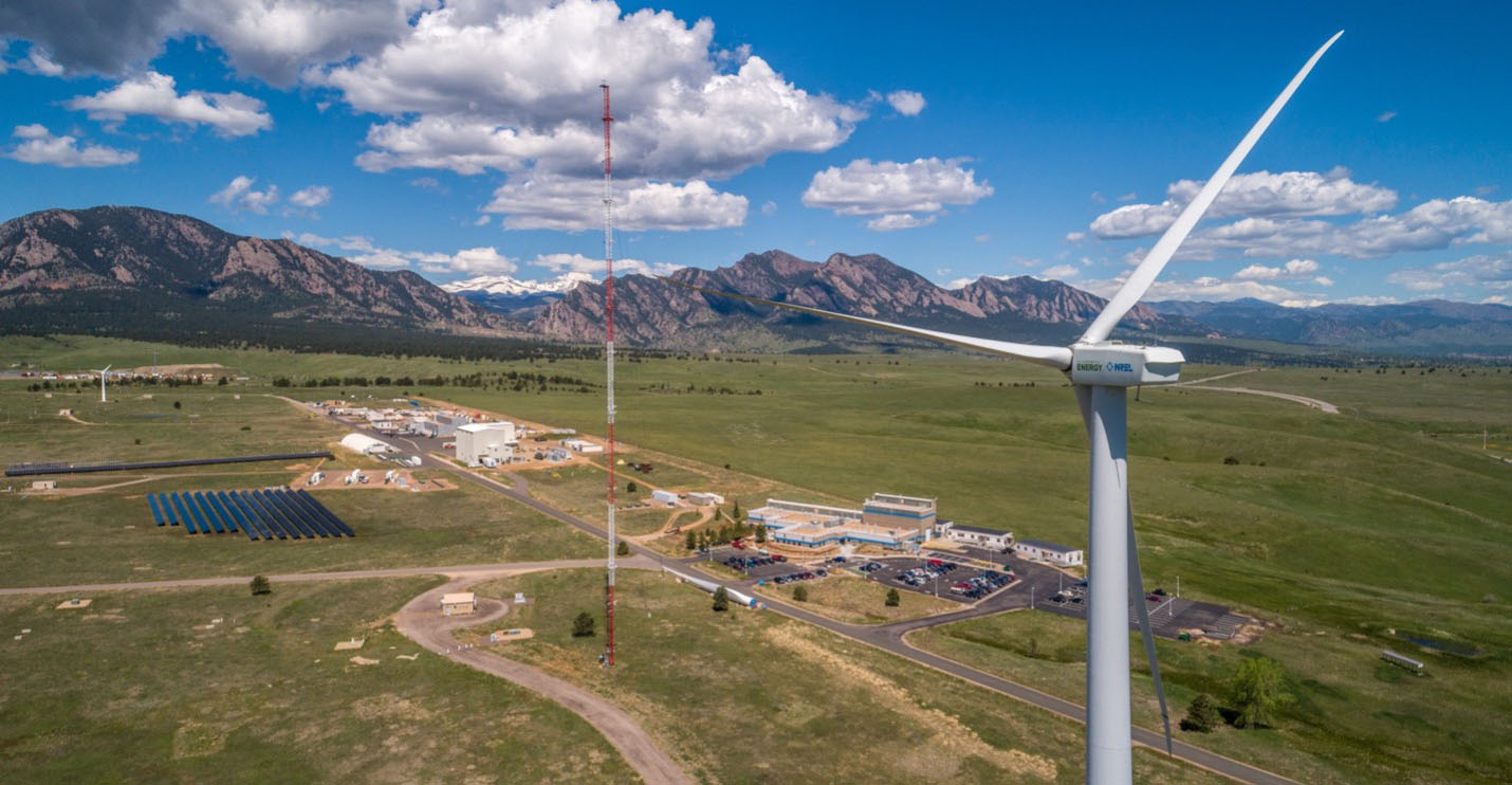 Aerial view of Flatirons Campus with wind turbine in the foreground.