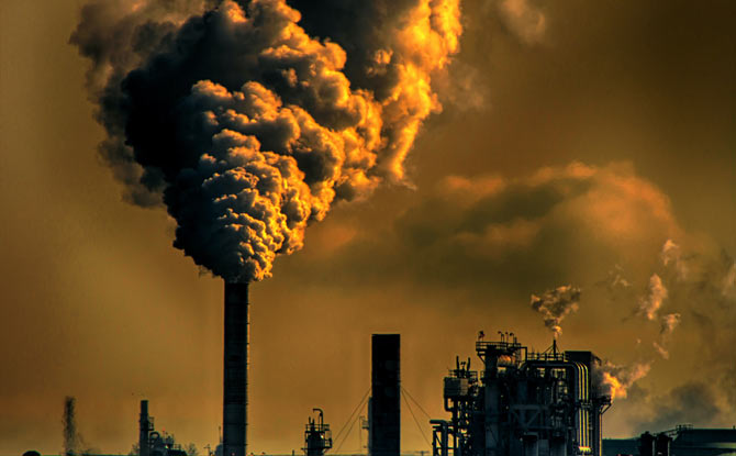 A plume of smoke rising from a smokestack.