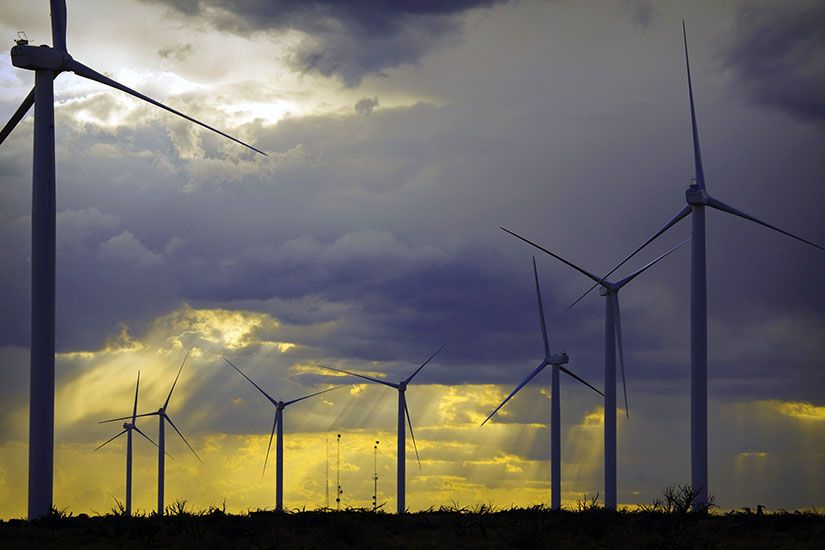 Wind turbines at sunset.