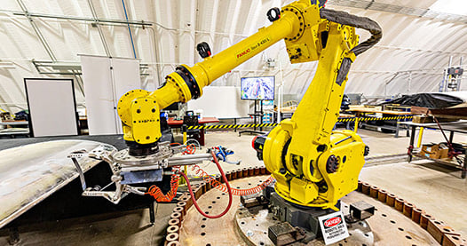 A stock image of a yellow robotic machine.