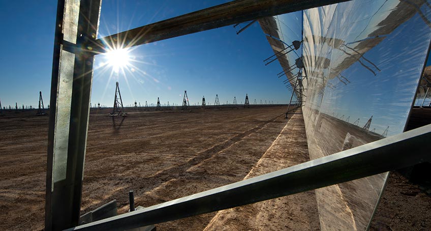 Light is reflected in a parabolic trough collector at Abengoa's Solana Plant