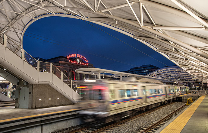 A train moving through a train platform at Denver's Union Station.